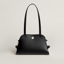 Hunter cowhide, Swift calf leather, and H canvas handbag.
